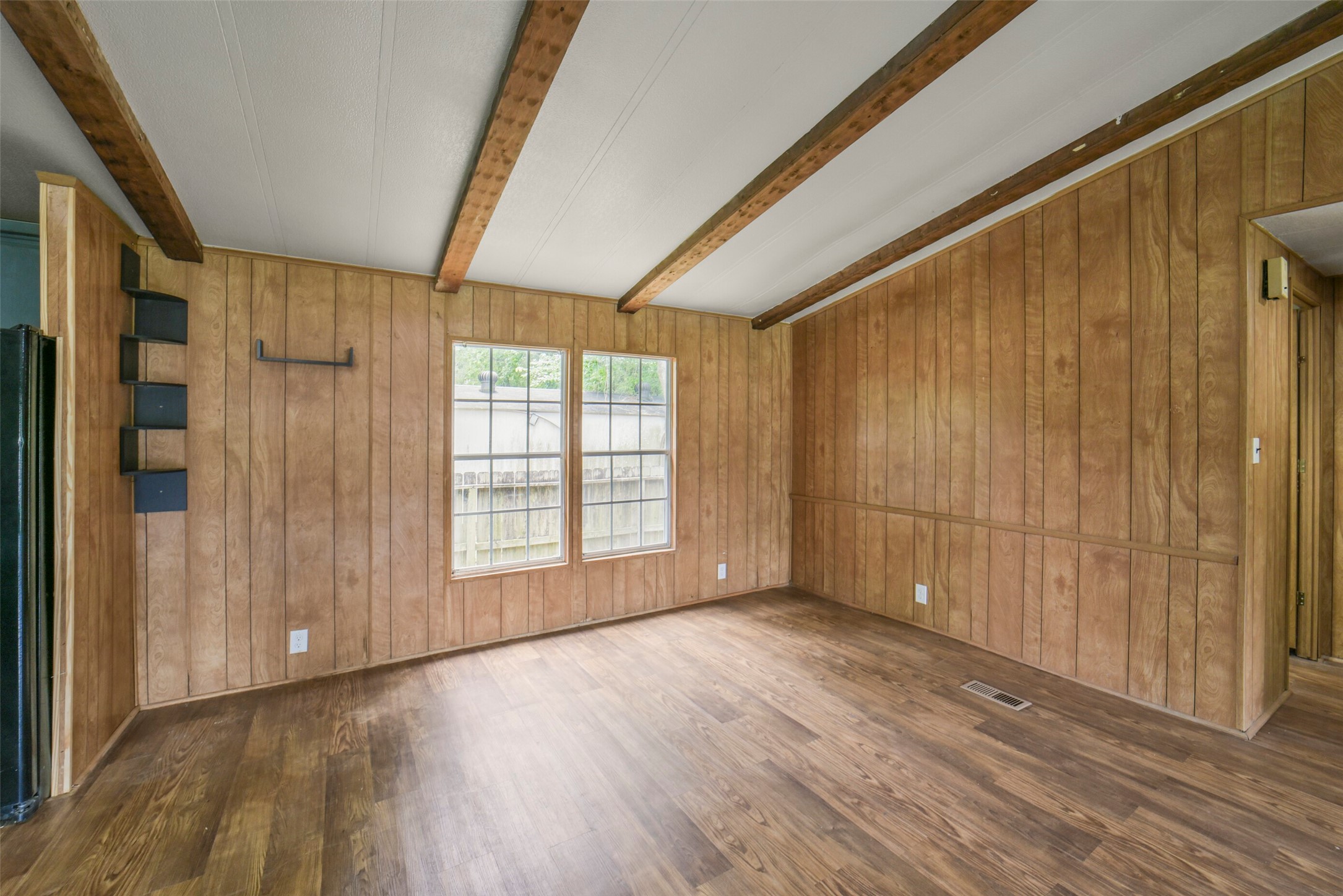11023 Forrest Valley Drive Houston, TX 77065 - Photo 11 of 47 a view of an empty room with wooden floor and a window