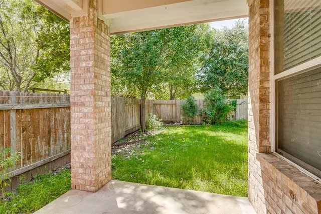 a backyard of a house with green walls