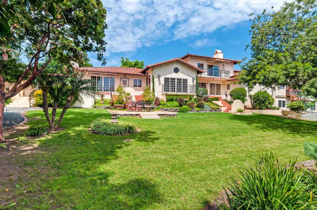 725 Hamilton Lane Fallbrook, CA 92028 - Photo 12 of 54 a front view of a house with a yard