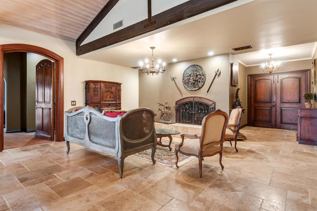 725 Hamilton Lane Fallbrook, CA 92028 - Photo 14 of 54 a living room with furniture and a clock