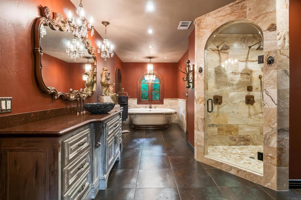 725 Hamilton Lane Fallbrook, CA 92028 - Photo 19 of 54 a bathroom with a sink a vanity a mirror and shower