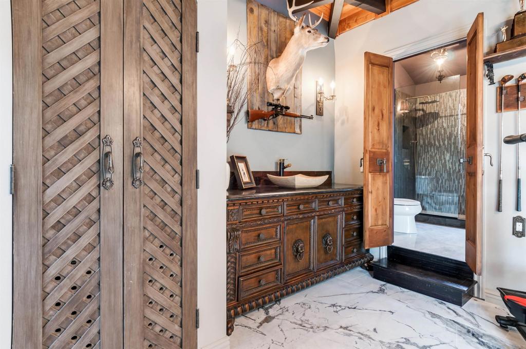 725 Hamilton Lane Fallbrook, CA 92028 - Photo 23 of 54 a bathroom with a granite countertop sink a toilet and shower