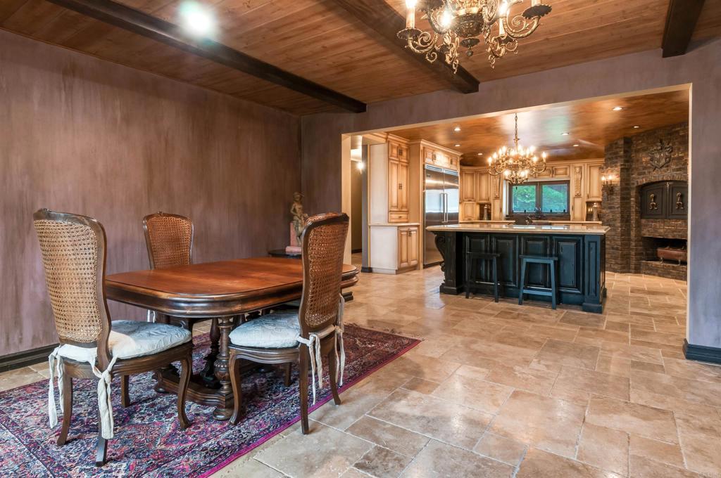 725 Hamilton Lane Fallbrook, CA 92028 - Photo 24 of 54 a view of a dining room with furniture wooden floor and chandelier