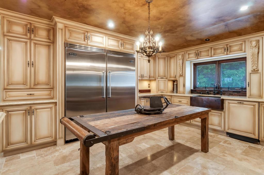 725 Hamilton Lane Fallbrook, CA 92028 - Photo 27 of 54 a kitchen with stainless steel appliances kitchen island granite countertop a refrigerator a stove and a sink with granite countertops