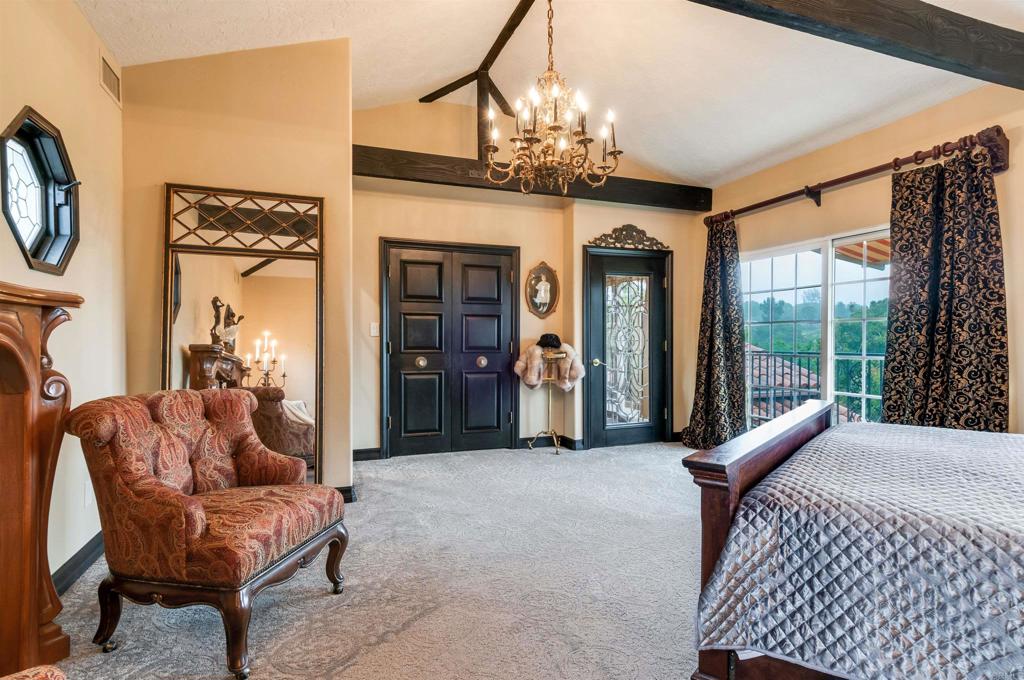 725 Hamilton Lane Fallbrook, CA 92028 - Photo 38 of 54 a living room with furniture a chandelier and a large window