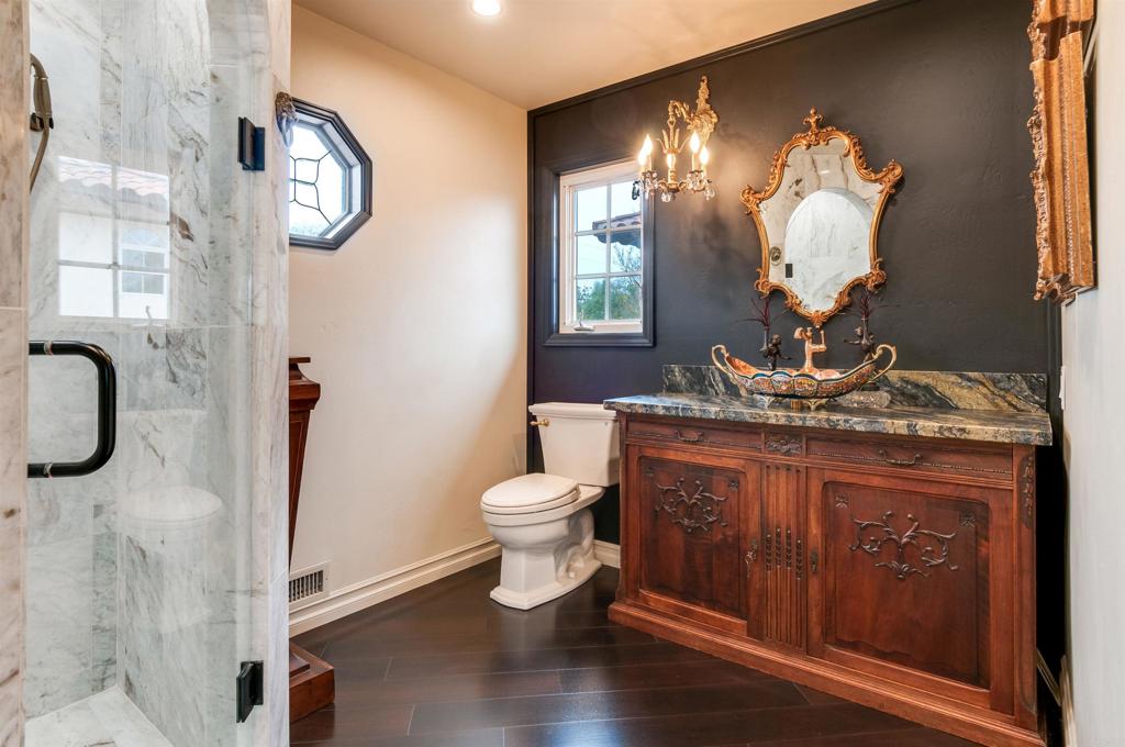 725 Hamilton Lane Fallbrook, CA 92028 - Photo 39 of 54 a bathroom with a toilet sink and mirror