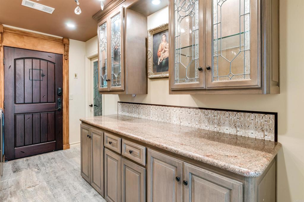 725 Hamilton Lane Fallbrook, CA 92028 - Photo 44 of 54 a bathroom with a granite countertop sink and a window