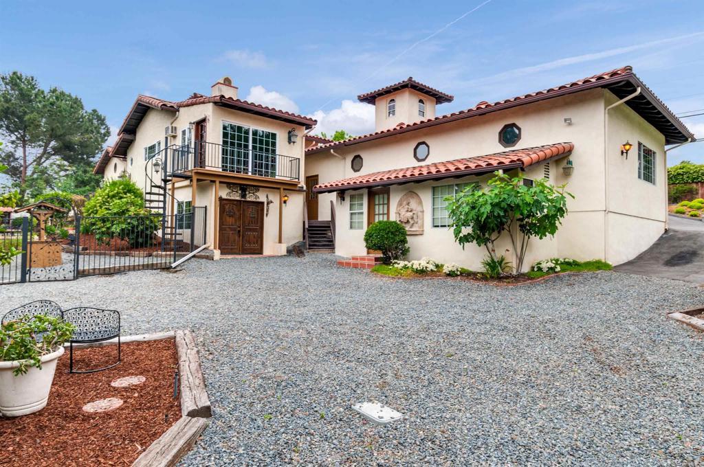 725 Hamilton Lane Fallbrook, CA 92028 - Photo 54 of 54 a front view of a house with a yard and potted plants