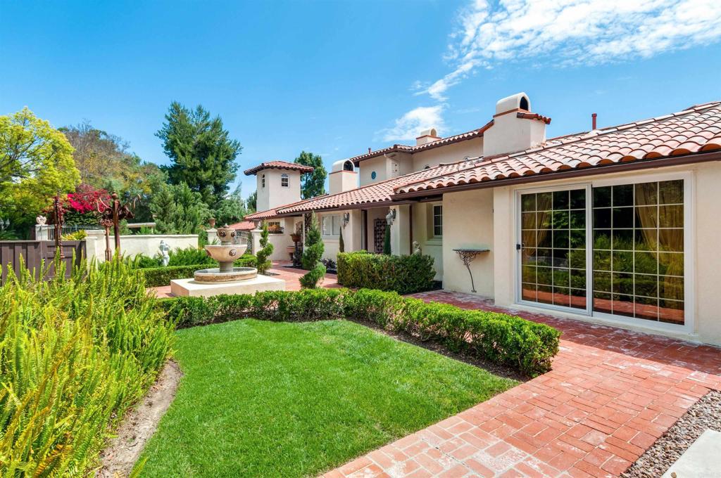 725 Hamilton Lane Fallbrook, CA 92028 - Photo 6 of 54 a front view of a house with a yard and potted plants