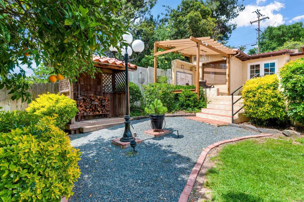 725 Hamilton Lane Fallbrook, CA 92028 - Photo 10 of 54 a view of a house with a yard and garden
