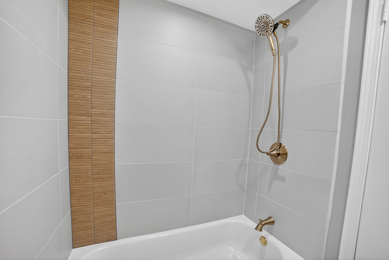 525 North Springfield Avenue Chicago, IL 60624 - Photo 15 of 24 a bathroom with a shower and a bath tub