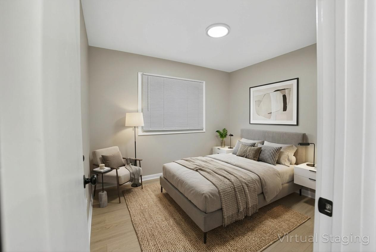 525 North Springfield Avenue Chicago, IL 60624 - Photo 19 of 24 a bedroom with a bed and a chair