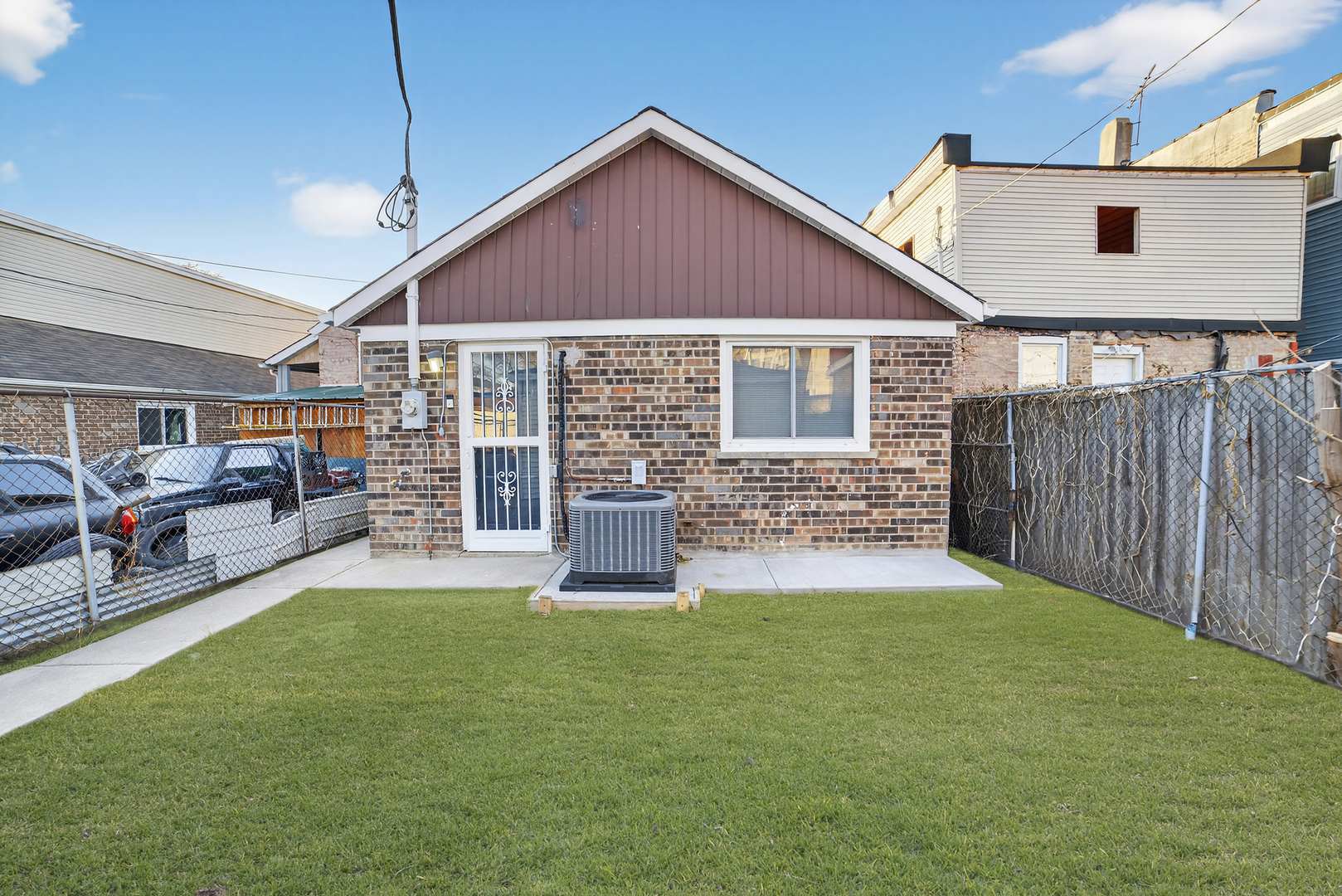 525 North Springfield Avenue Chicago, IL 60624 - Photo 23 of 24 a view of a house with a yard and sitting area