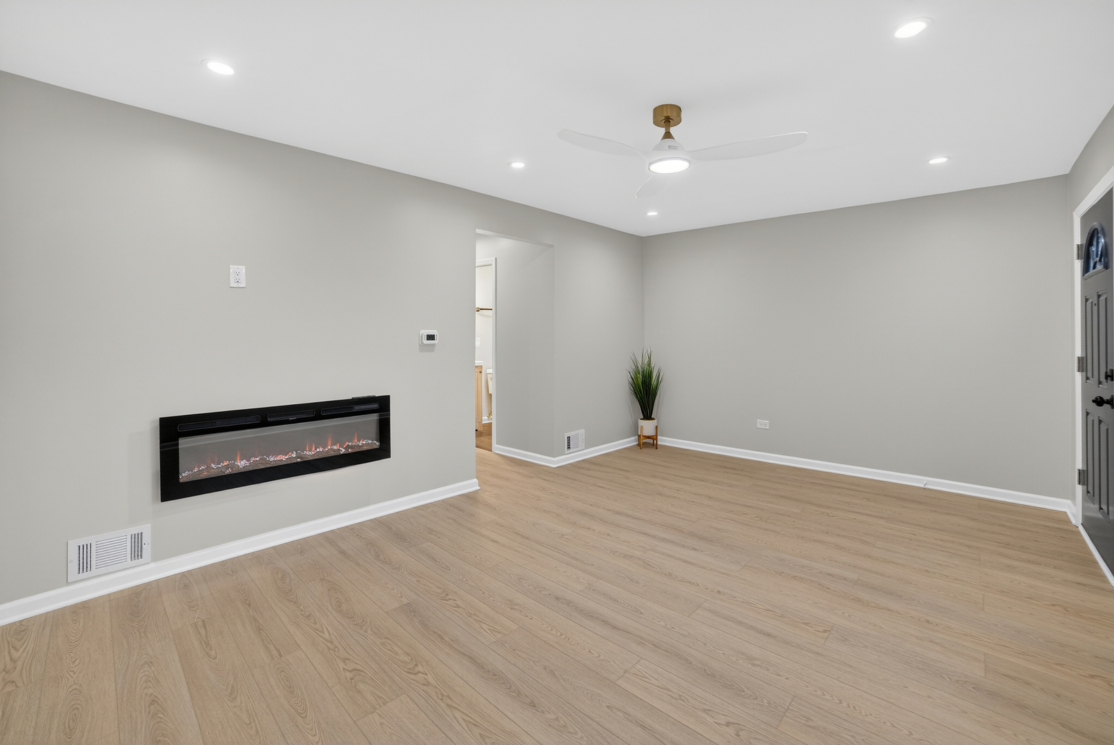 525 North Springfield Avenue Chicago, IL 60624 - Photo 3 of 24 an empty room with wooden floor and natural light