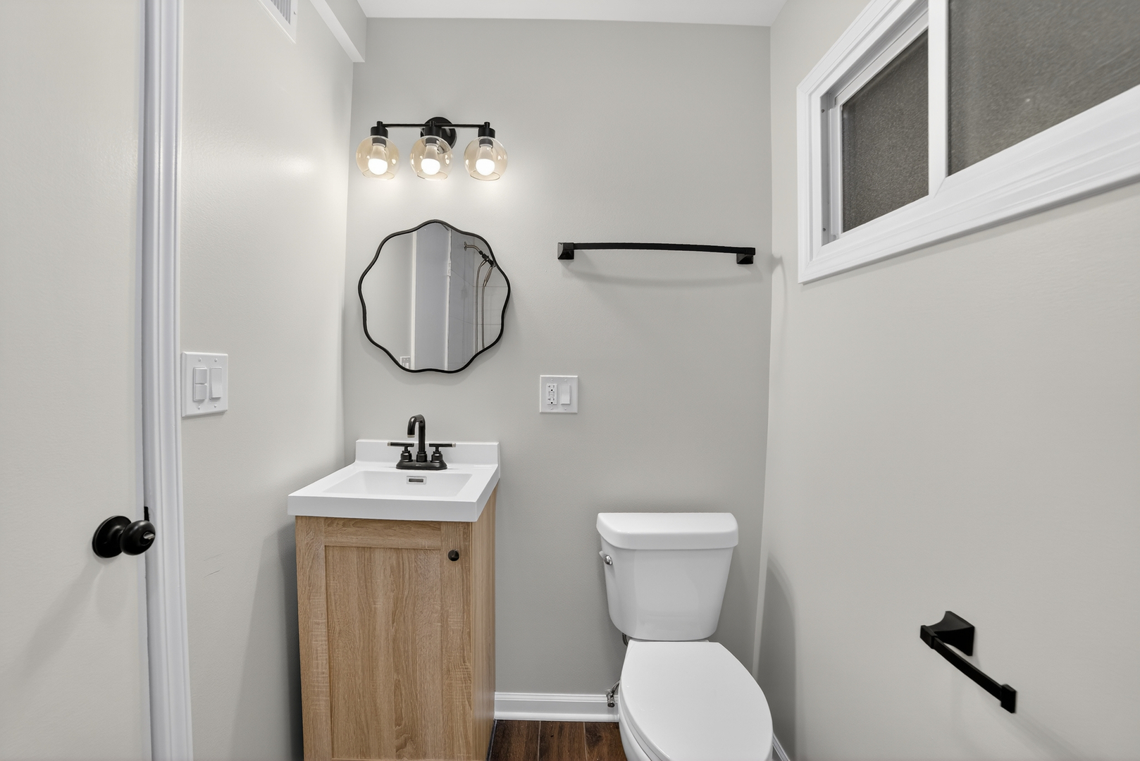 525 North Springfield Avenue Chicago, IL 60624 - Photo 4 of 24 a bathroom with a sink mirror and toilet