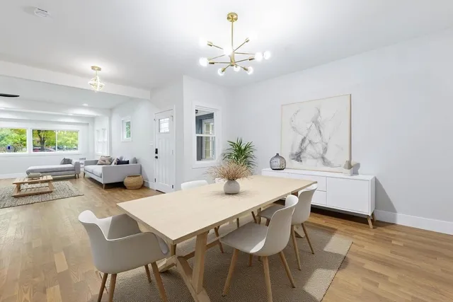 a dining room with furniture and window