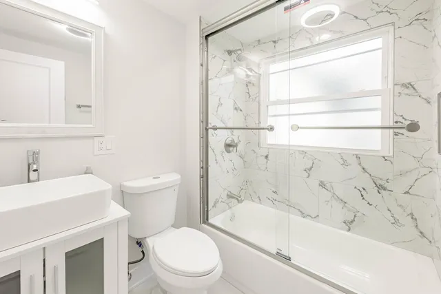 a bathroom with a sink a toilet and a bathtub