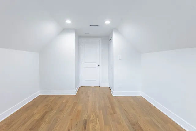 a view of wooden floor in an empty room