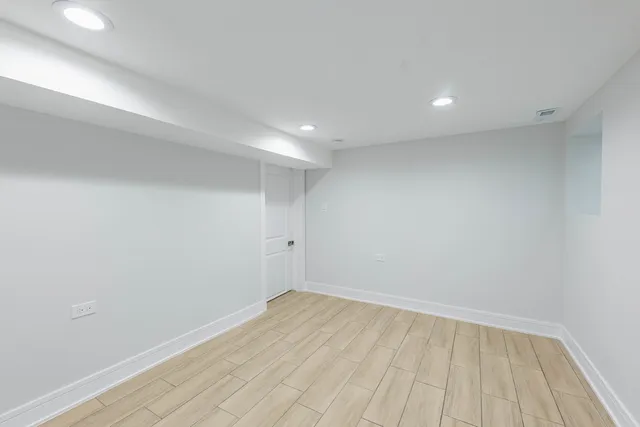 a view of room with wooden floor