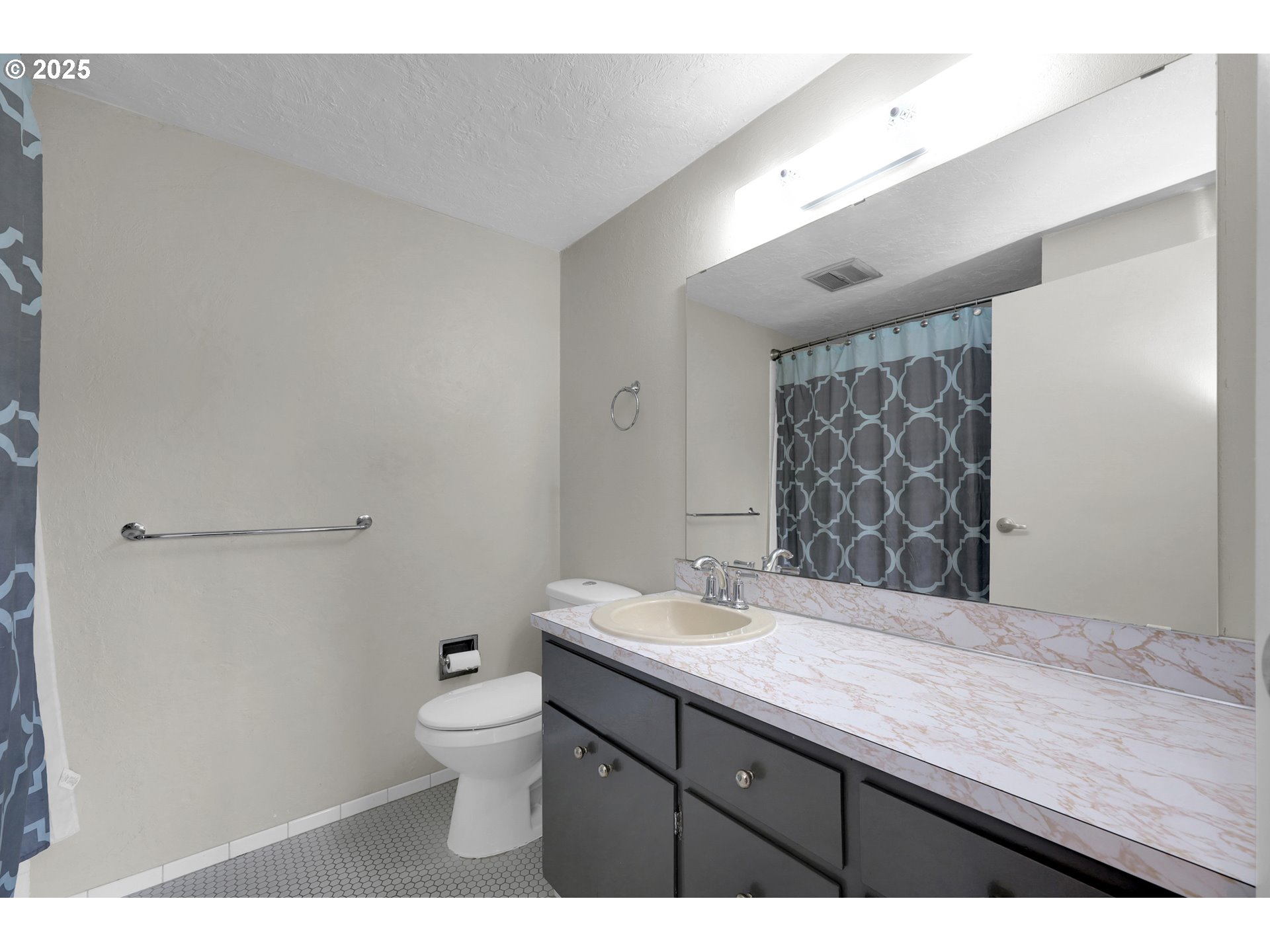 3765 Potter Street Eugene, OR 97405 - Photo 17 of 48 a bathroom with a granite countertop sink a toilet and a mirror