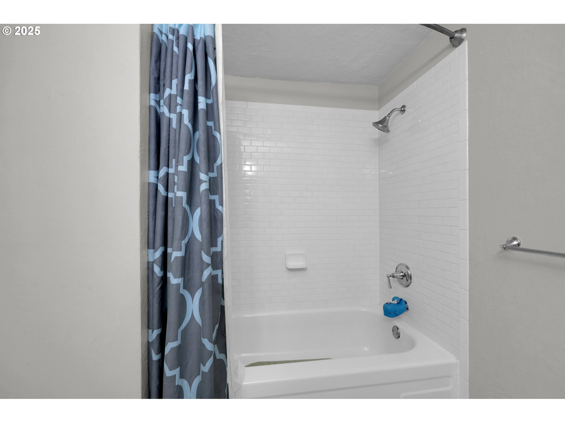 3765 Potter Street Eugene, OR 97405 - Photo 18 of 48 a bathroom with a bathtub and shower