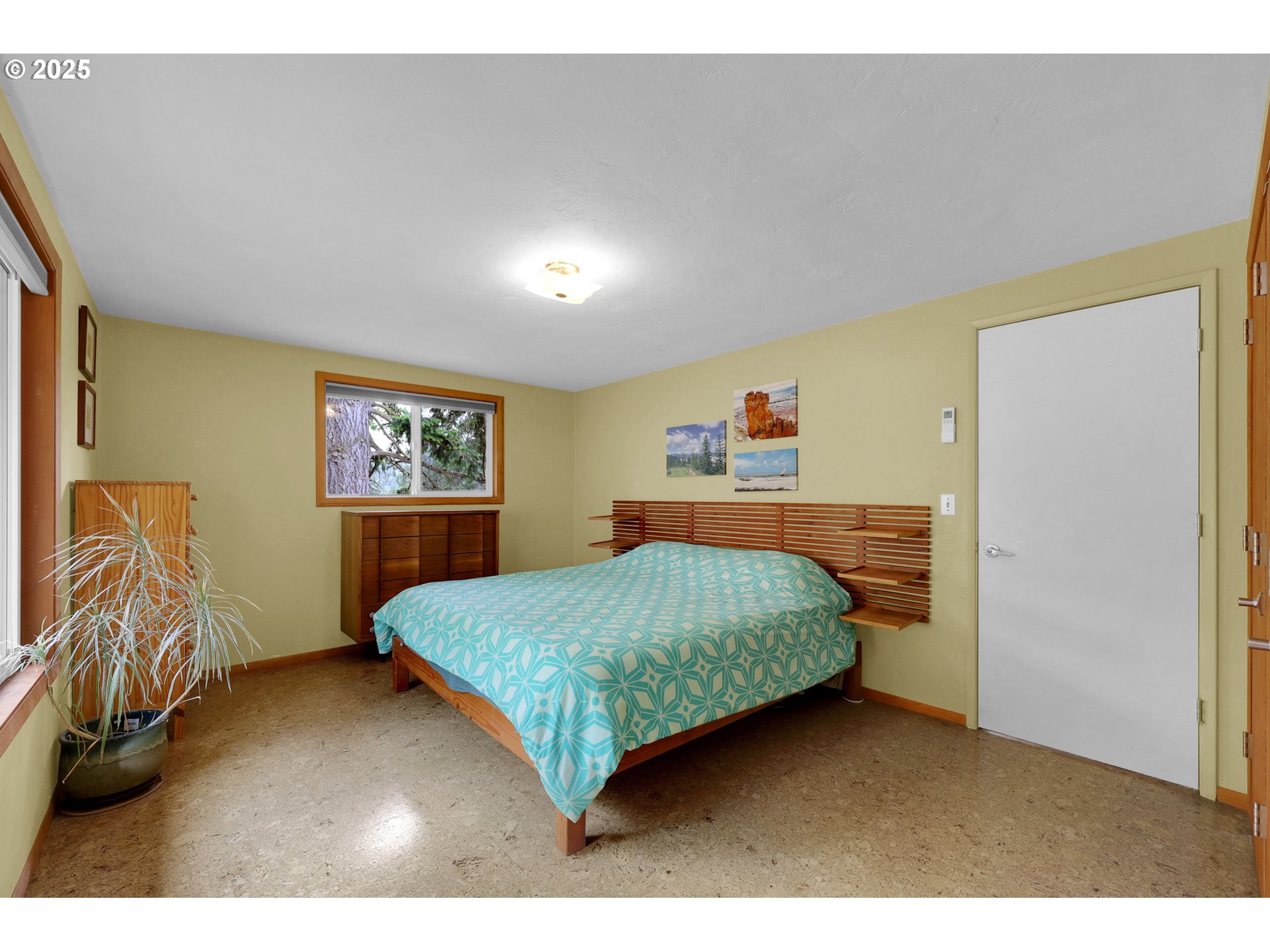 3765 Potter Street Eugene, OR 97405 - Photo 22 of 48 a bedroom with a bed and a painting on the wall