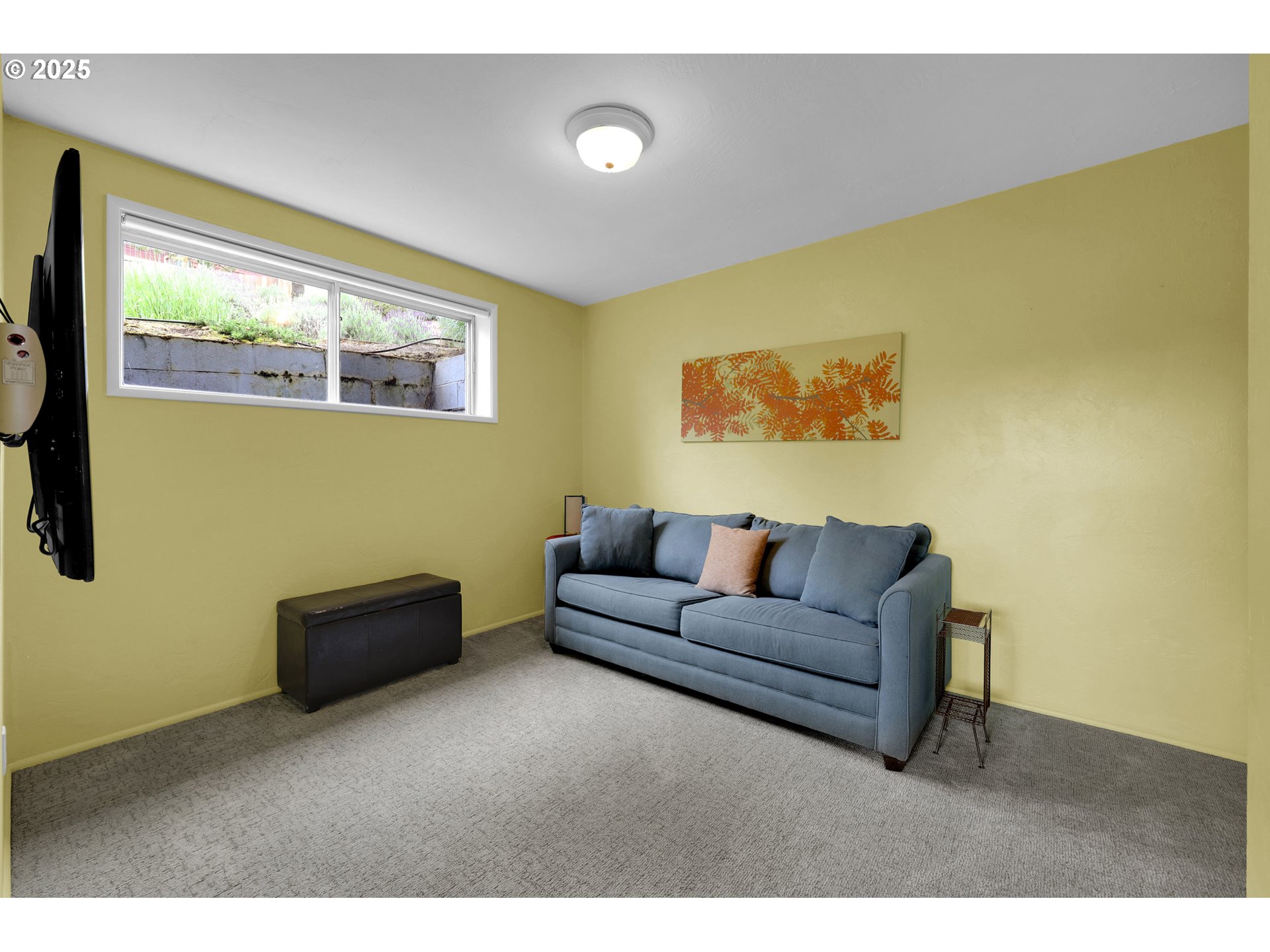 3765 Potter Street Eugene, OR 97405 - Photo 32 of 48 a living room with furniture and a flat screen tv