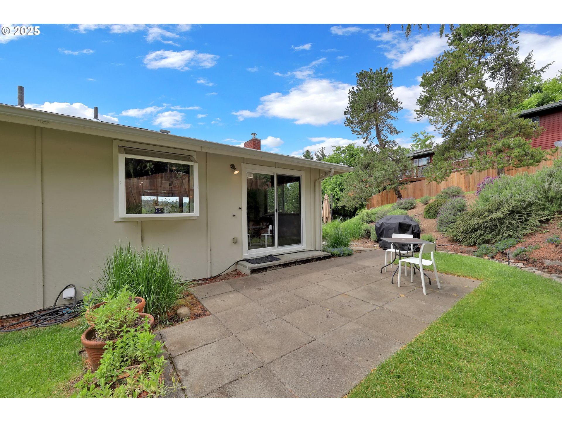 3765 Potter Street Eugene, OR 97405 - Photo 36 of 48 a view of a backyard with table and chairs and potted plants
