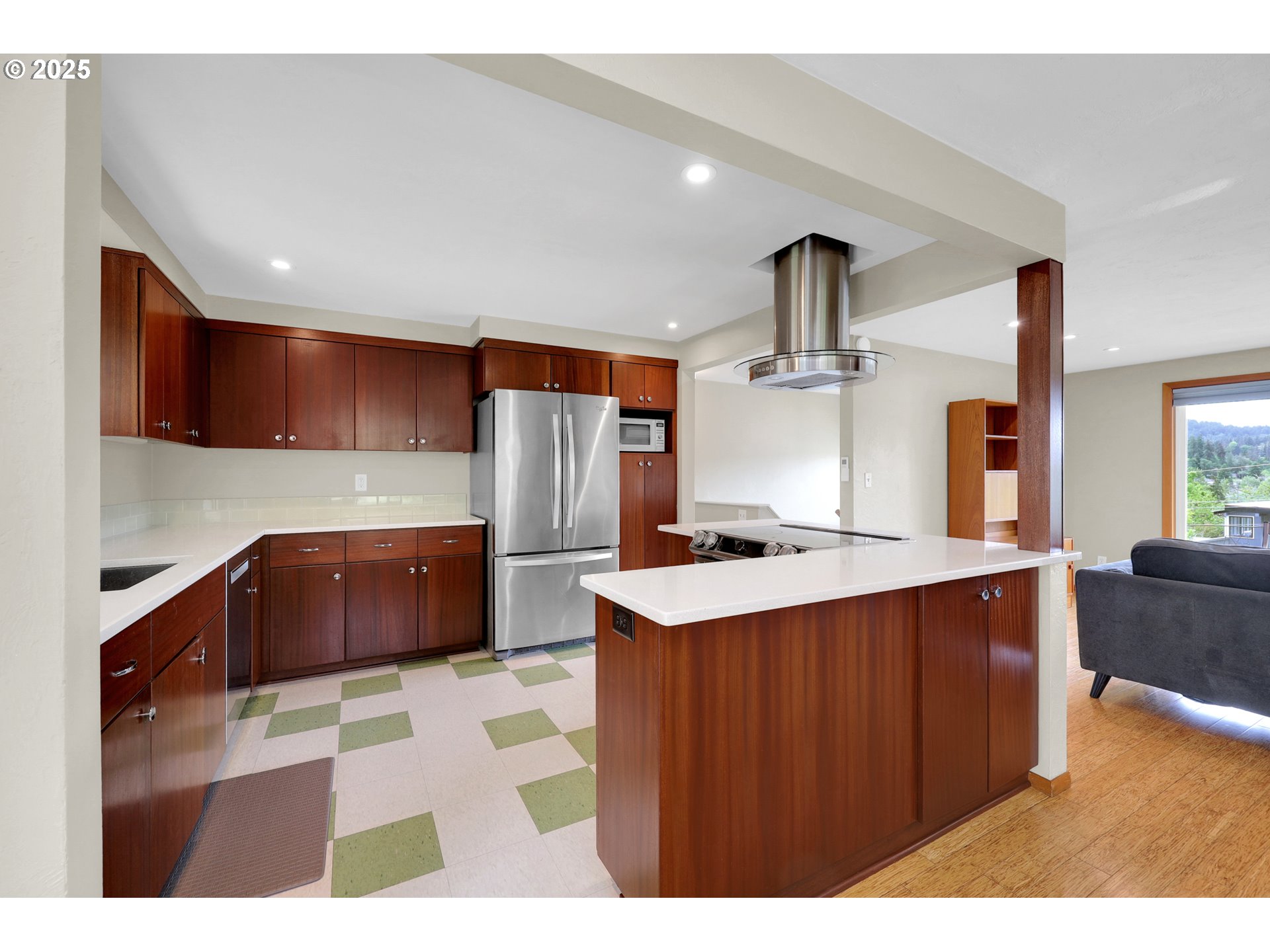 3765 Potter Street Eugene, OR 97405 - Photo 7 of 48 a kitchen with stainless steel appliances kitchen island wooden cabinets a stove a sink and a refrigerator