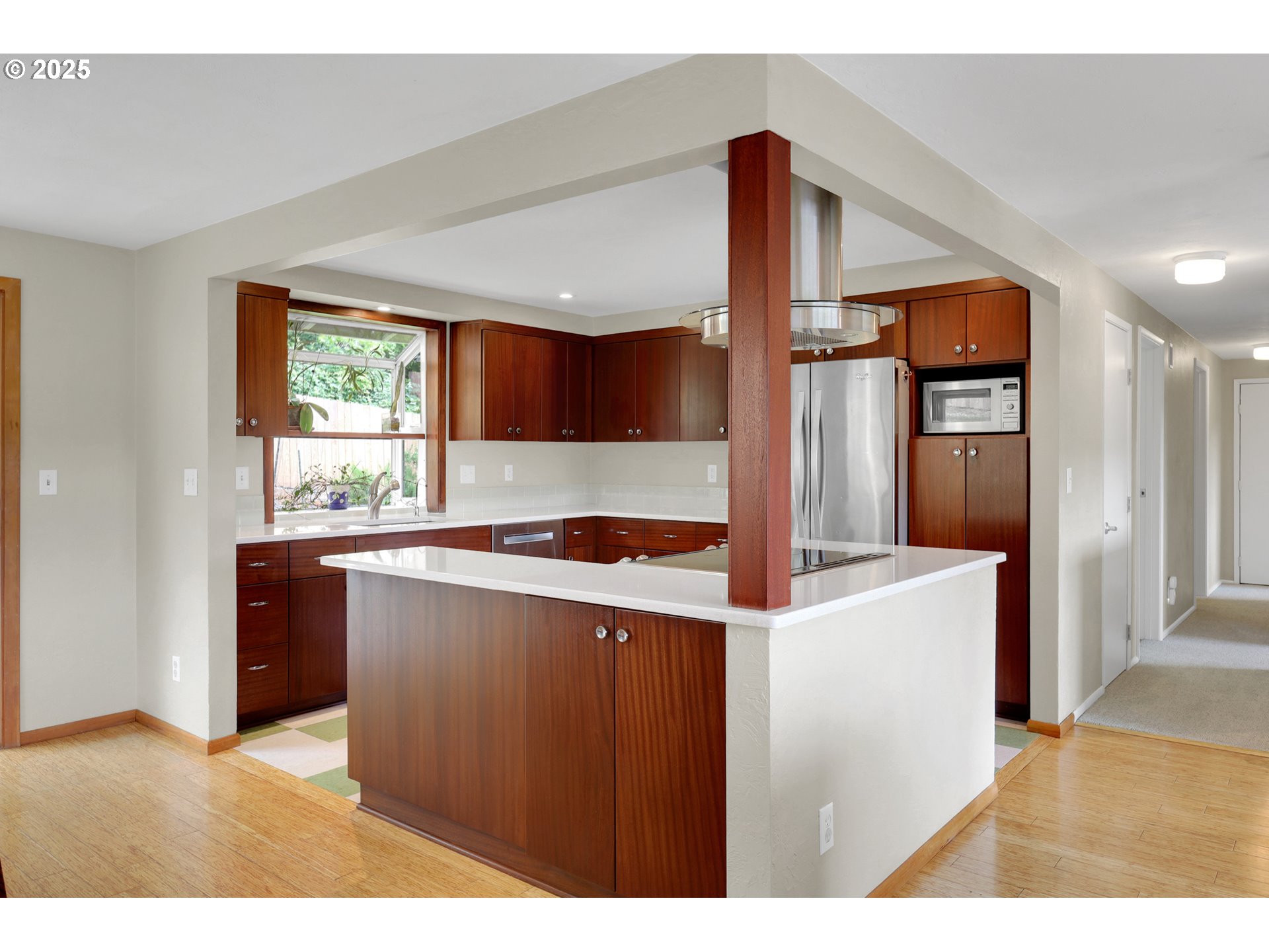 3765 Potter Street Eugene, OR 97405 - Photo 8 of 48 a kitchen with stainless steel appliances kitchen island granite countertop a refrigerator a sink and dishwasher