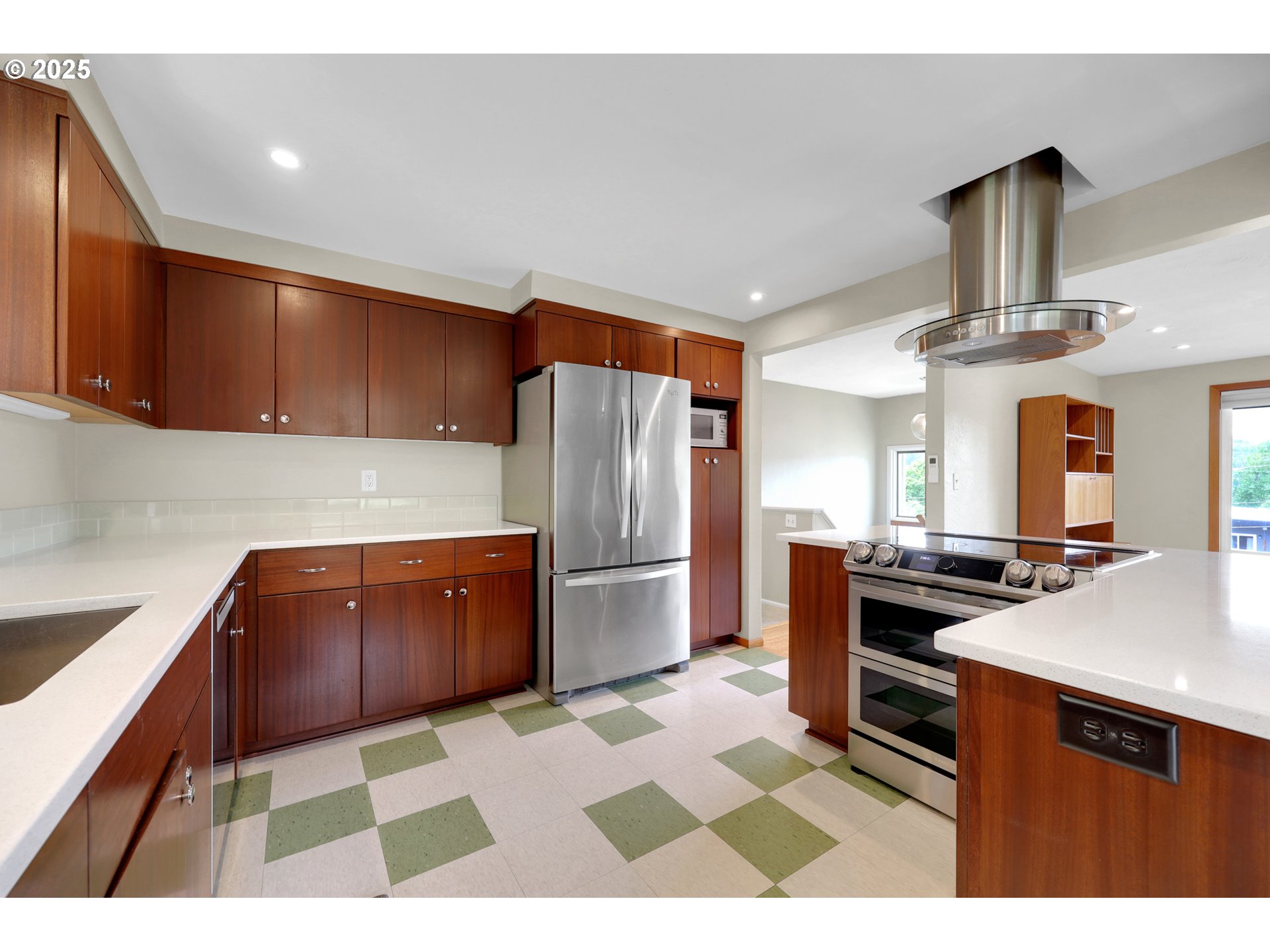 3765 Potter Street Eugene, OR 97405 - Photo 9 of 48 a kitchen with stainless steel appliances kitchen island granite countertop a refrigerator stove and sink