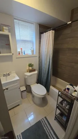 a bathroom with a toilet a sink and a shower