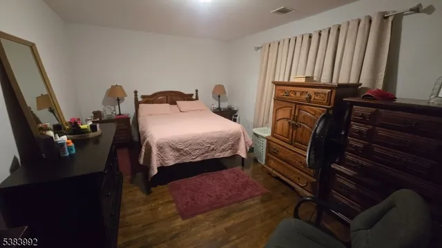 a bedroom with furniture and a window