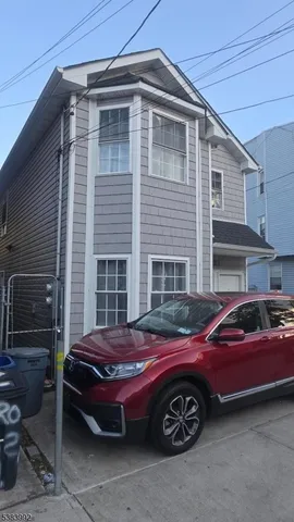 a front view of a house with parking space