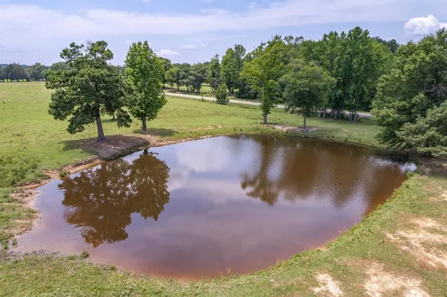 a view of a lake with a yard
