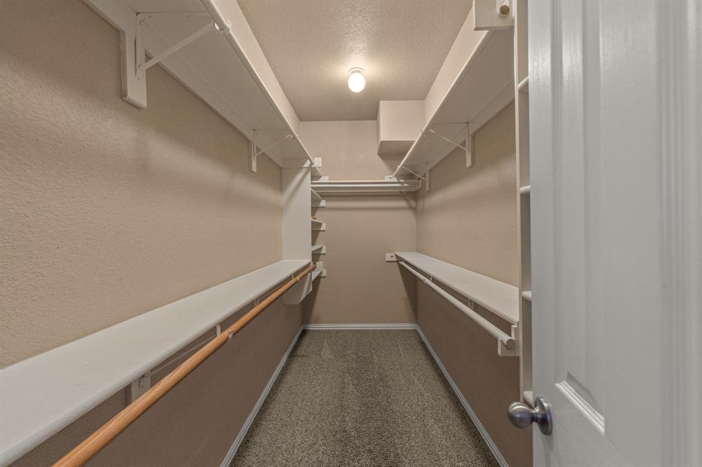 6501 Indian Trail Sanger, TX 76266 - Photo 21 of 39 Walk in closet featuring dark carpet