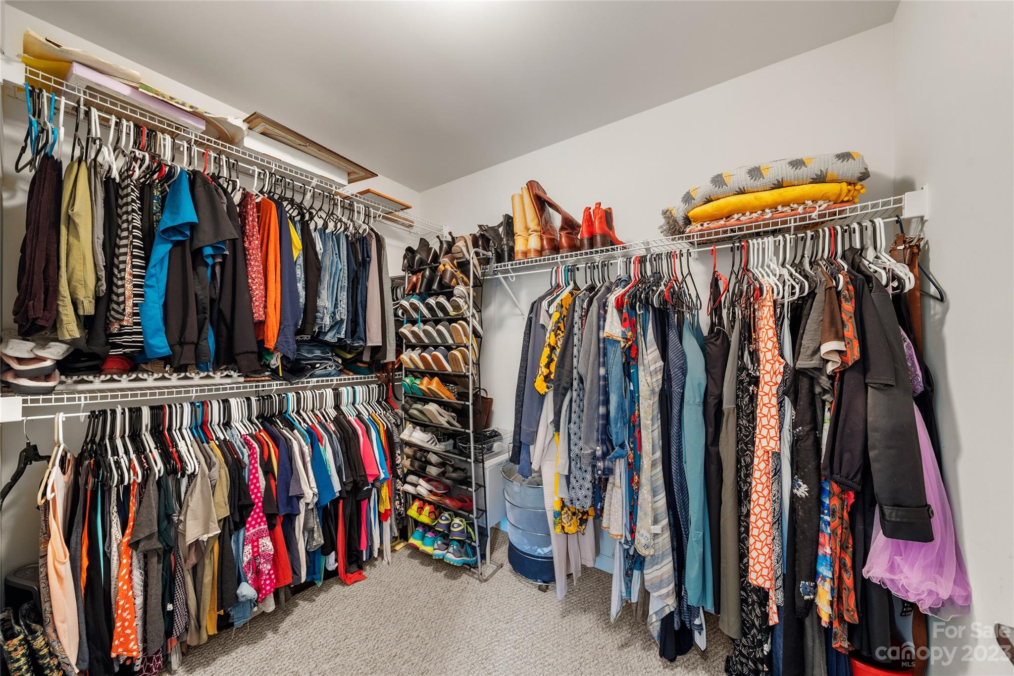 211 Roanoke Road Fletcher, NC 28732 - Photo 19 of 38 a view of walk in closet with clothes