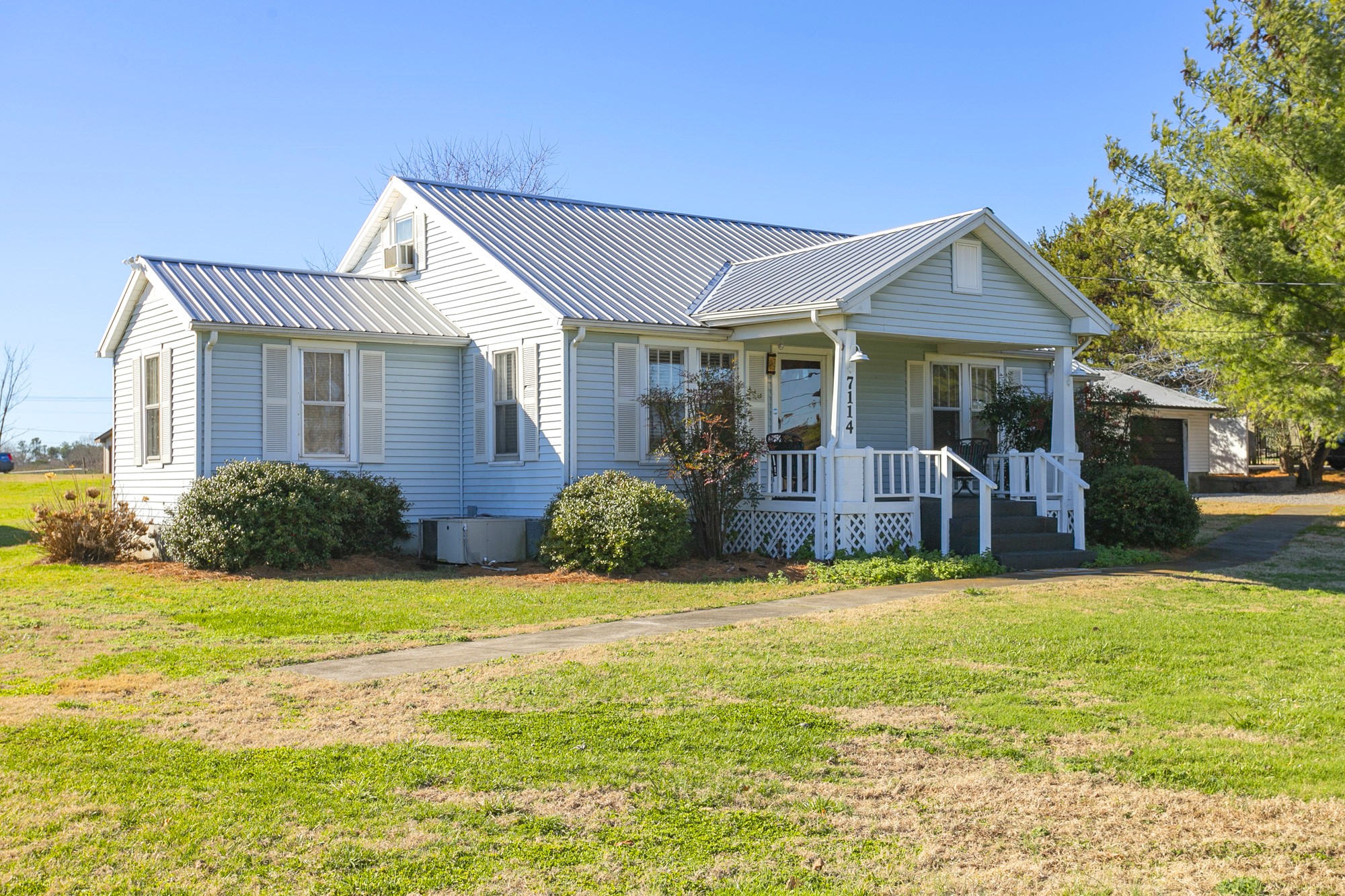 7114 Deer Ridge Road Fairview, TN 37062 - Photo 1 of 55 a view of a house with a yard and a large tree