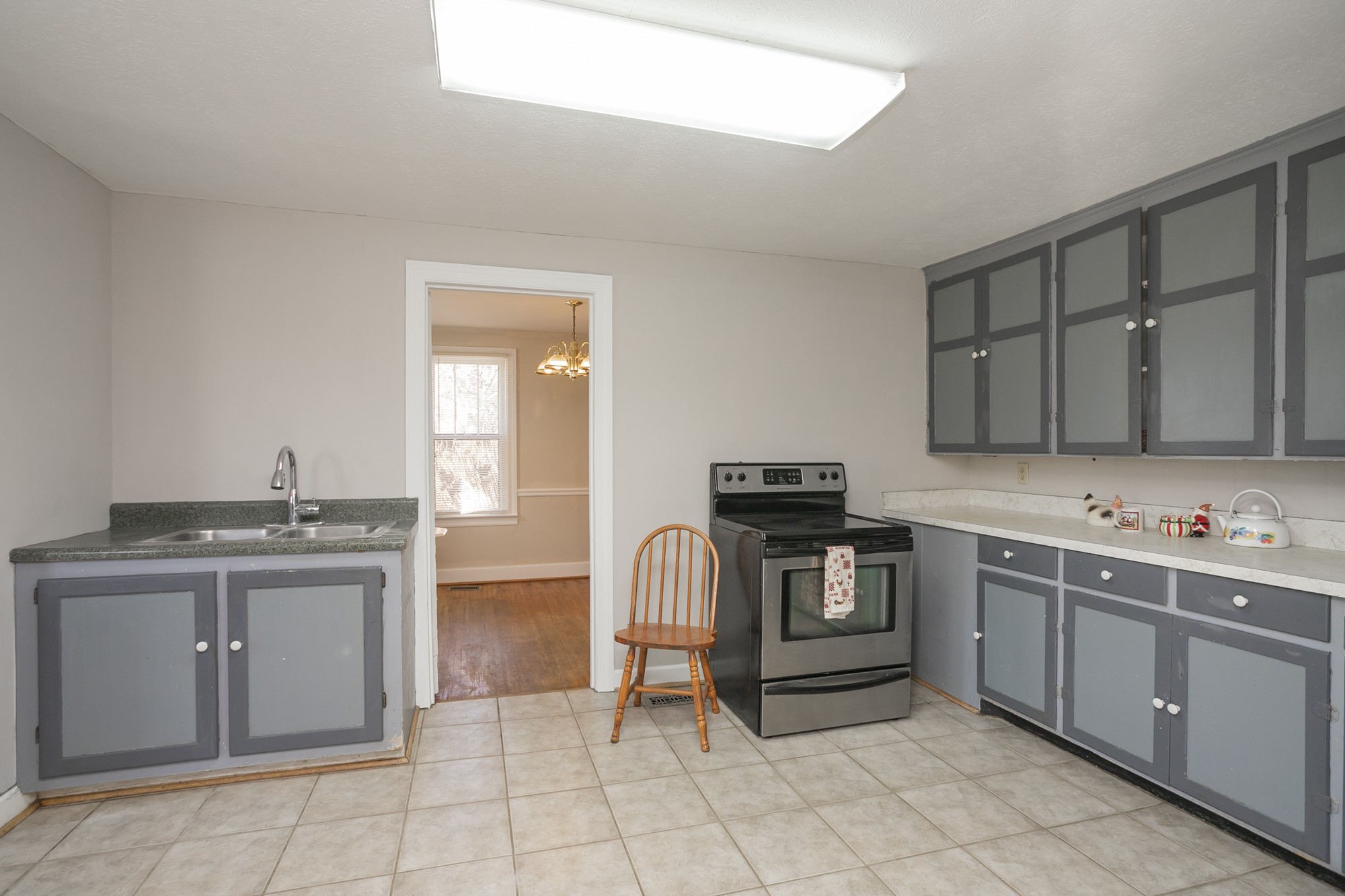 7114 Deer Ridge Road Fairview, TN 37062 - Photo 25 of 55 a kitchen with a stove sink and cabinets