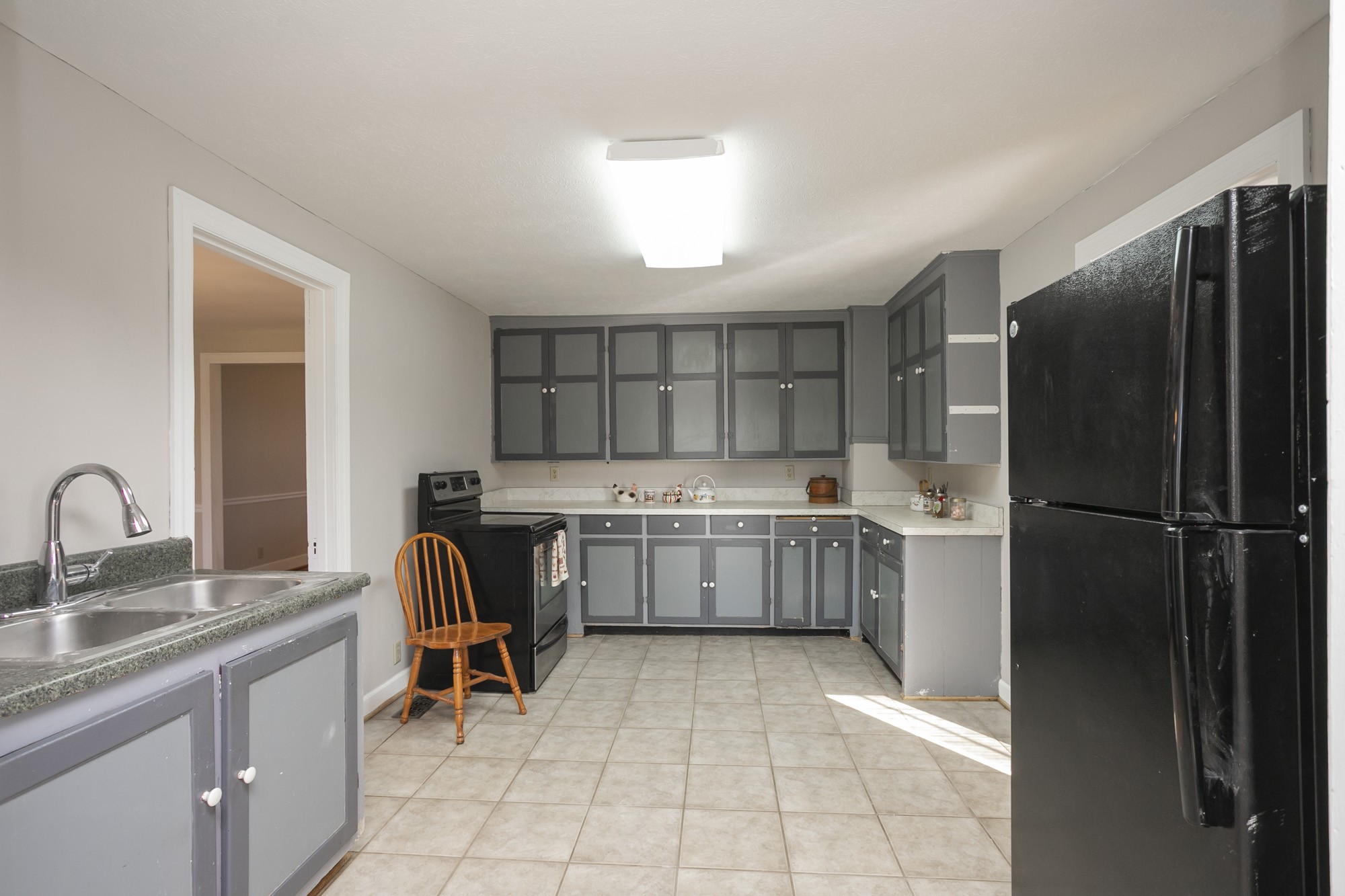 7114 Deer Ridge Road Fairview, TN 37062 - Photo 26 of 55 a kitchen with a refrigerator sink and cabinets