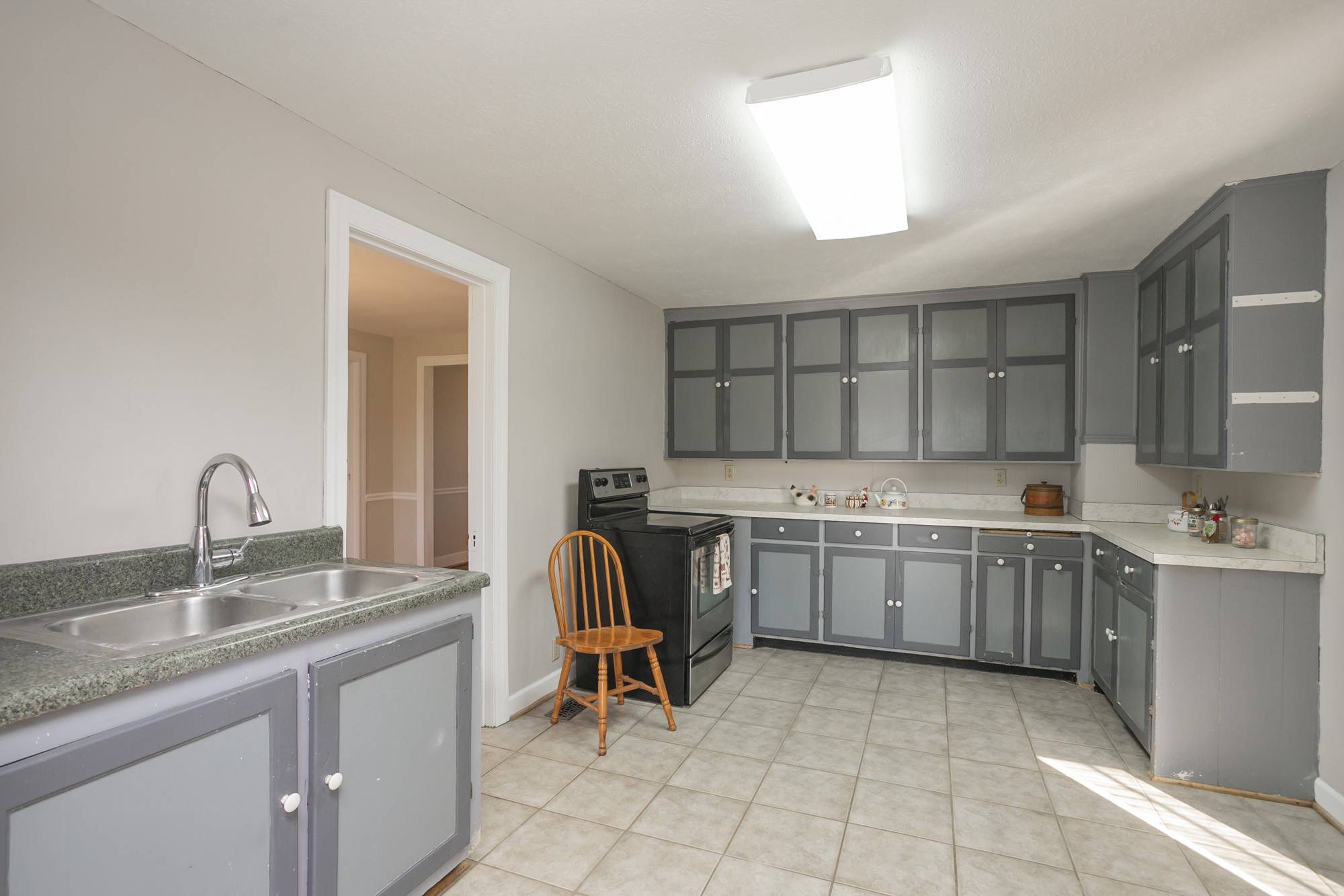 7114 Deer Ridge Road Fairview, TN 37062 - Photo 27 of 55 a kitchen with a sink stove and cabinets