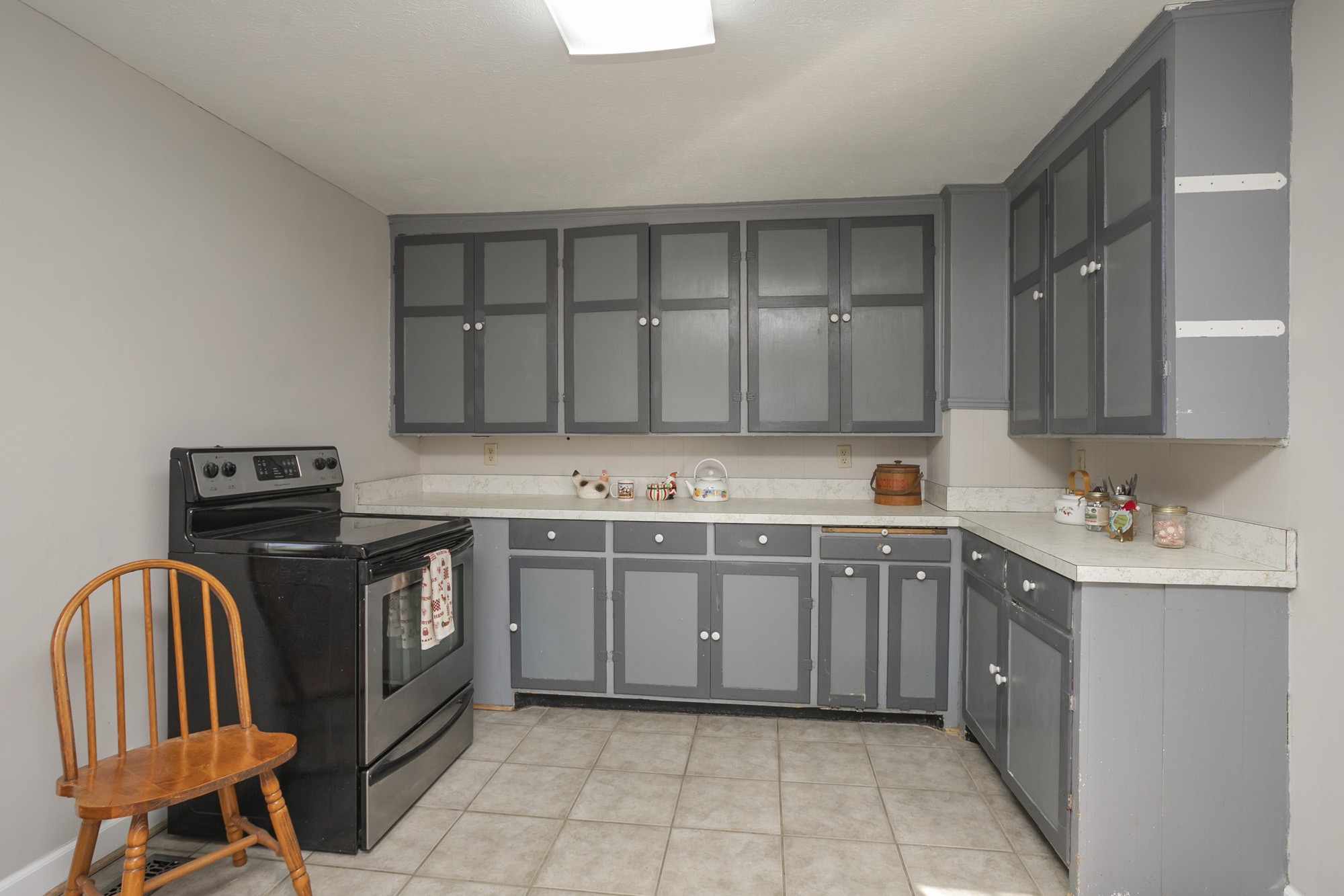 7114 Deer Ridge Road Fairview, TN 37062 - Photo 29 of 55 a kitchen with stainless steel appliances granite countertop a stove a sink and a microwave