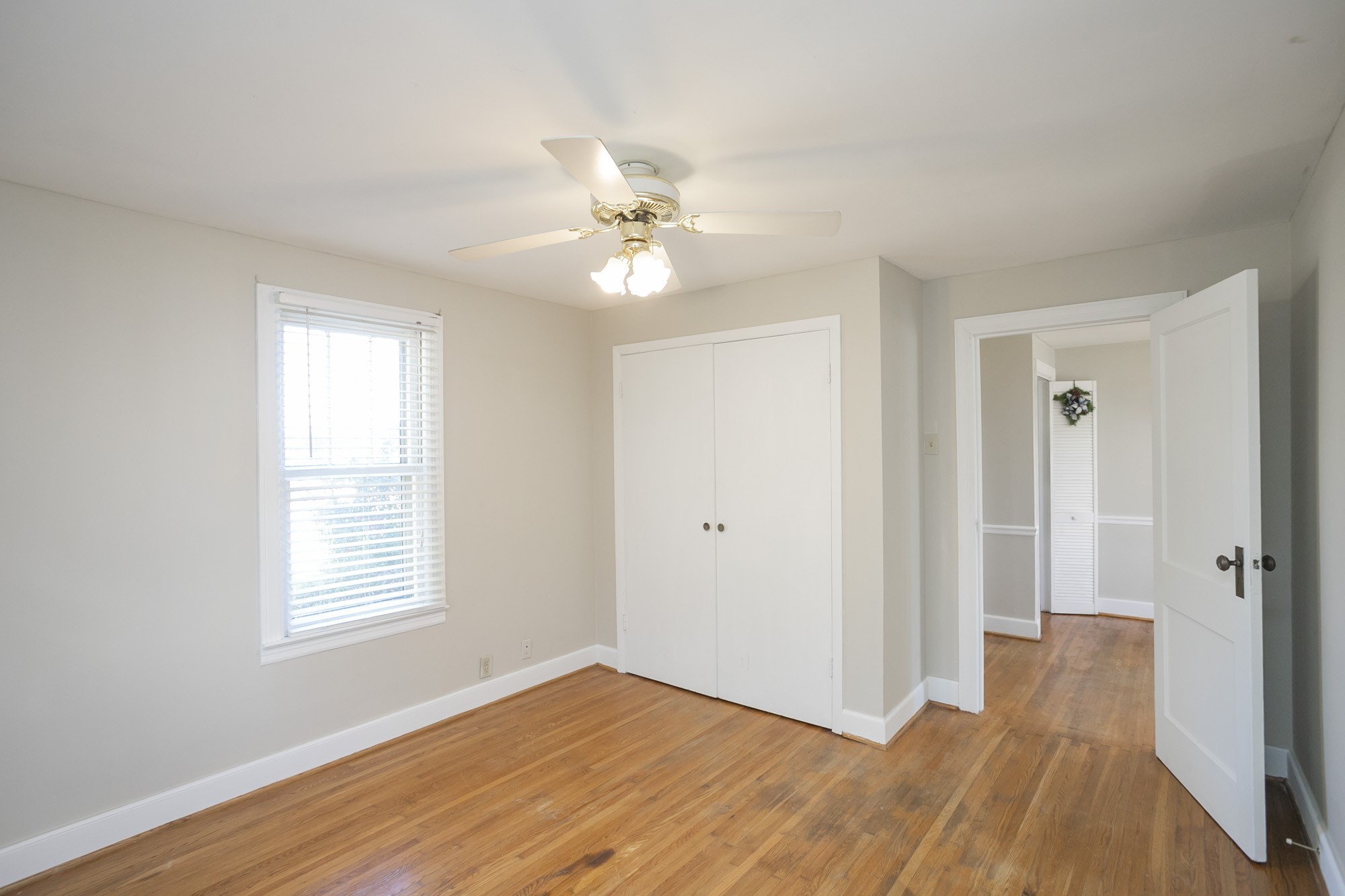 7114 Deer Ridge Road Fairview, TN 37062 - Photo 38 of 55 a view of an empty room with window and wooden floor