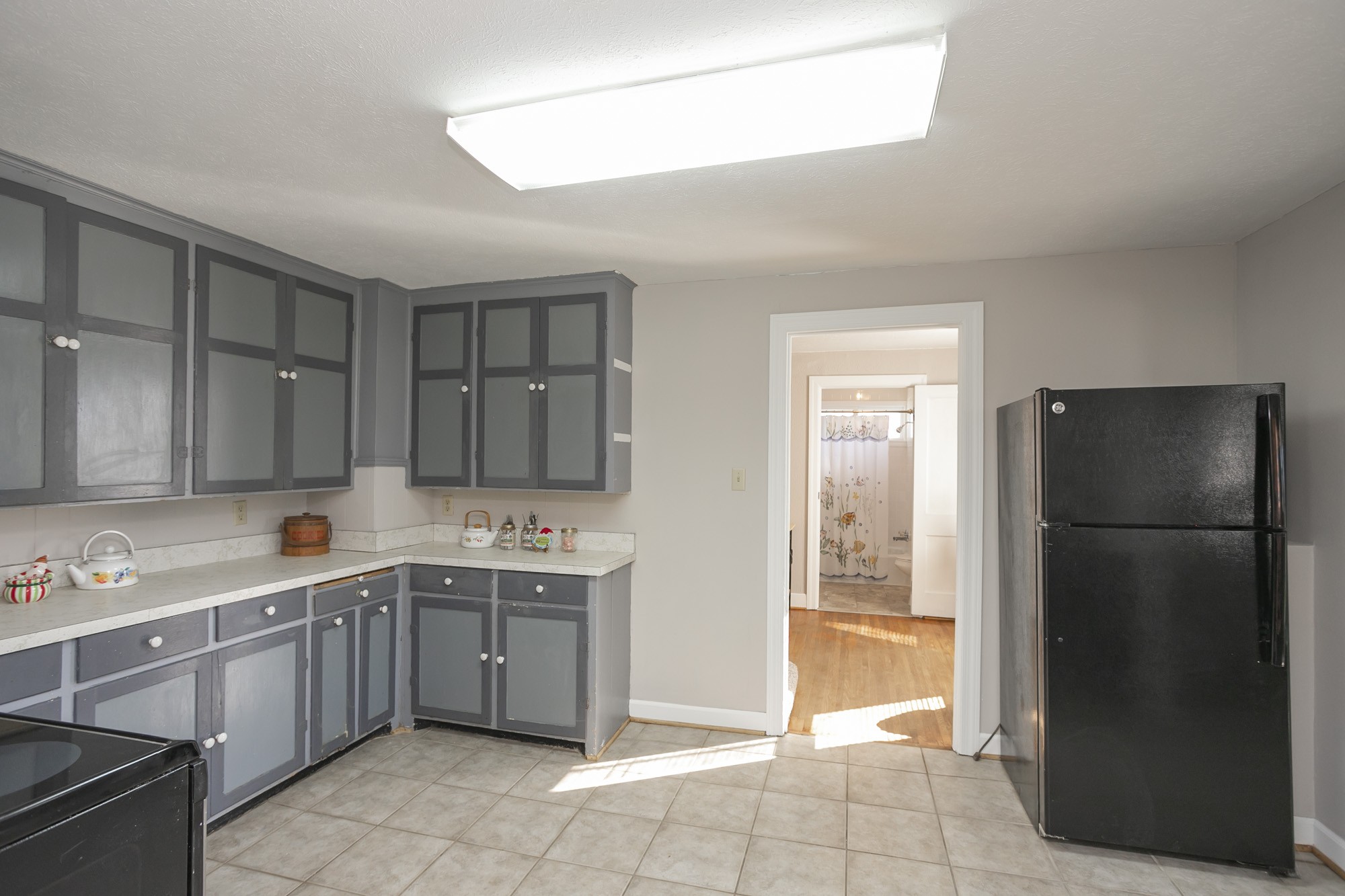7114 Deer Ridge Road Fairview, TN 37062 - Photo 40 of 55 a kitchen with a sink a refrigerator and cabinets