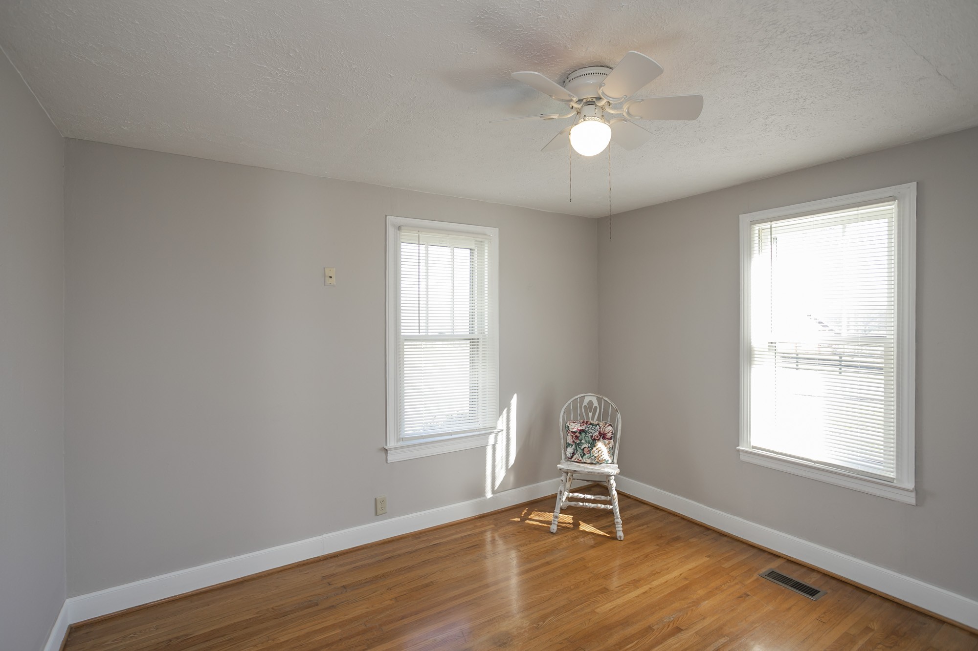 7114 Deer Ridge Road Fairview, TN 37062 - Photo 43 of 55 a view of an empty room with a window and wooden floor