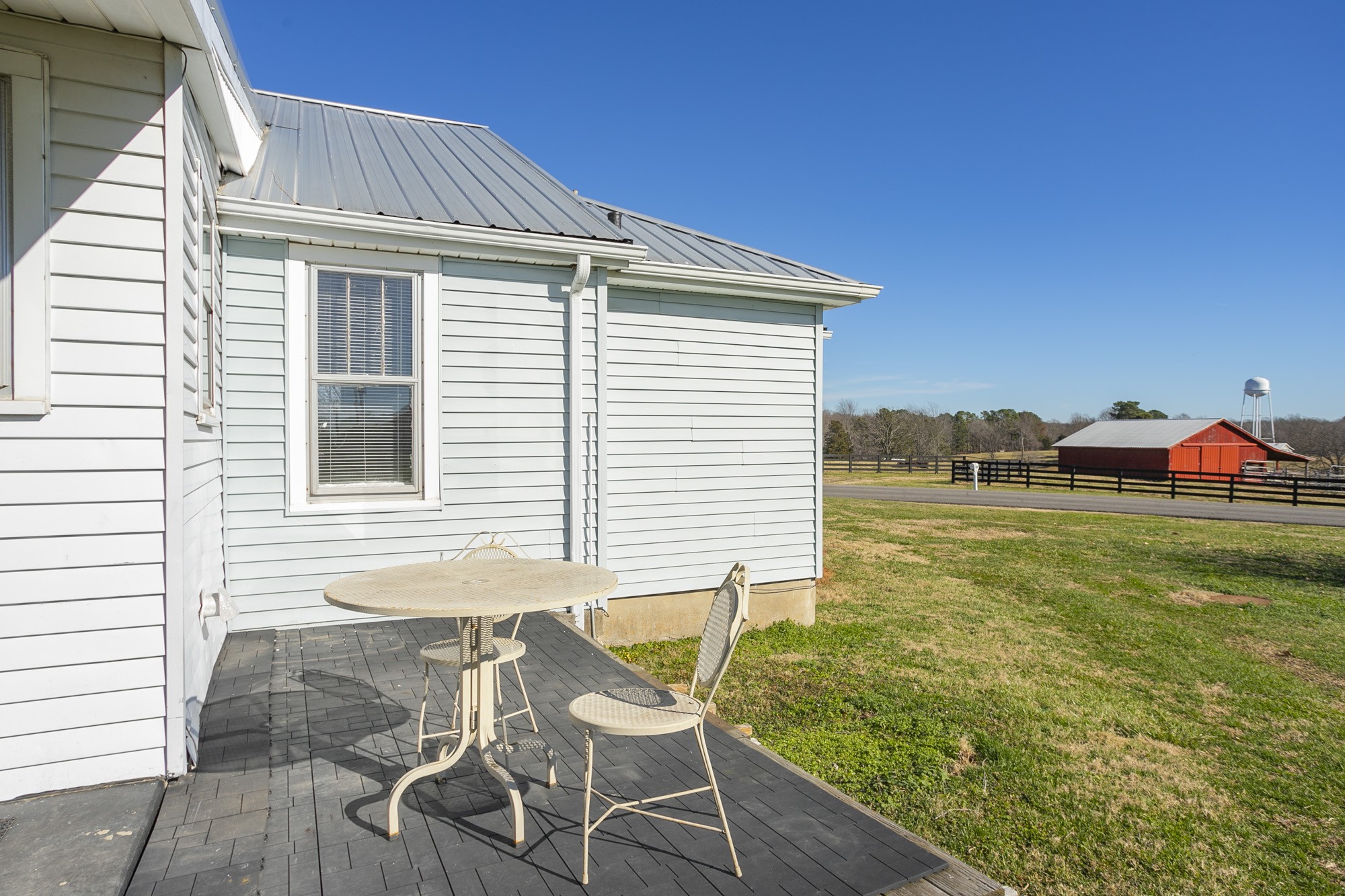 7114 Deer Ridge Road Fairview, TN 37062 - Photo 53 of 55 a backyard of a house with table and chairs