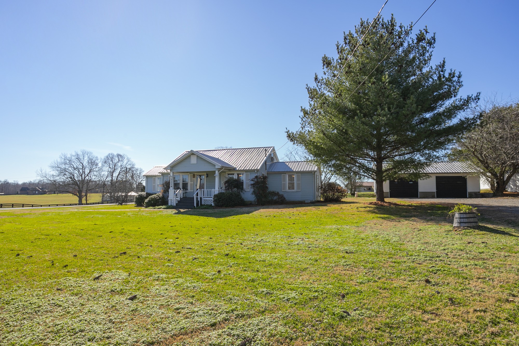 7114 Deer Ridge Road Fairview, TN 37062 - Photo 6 of 55 a house view with swimming pool in front of it
