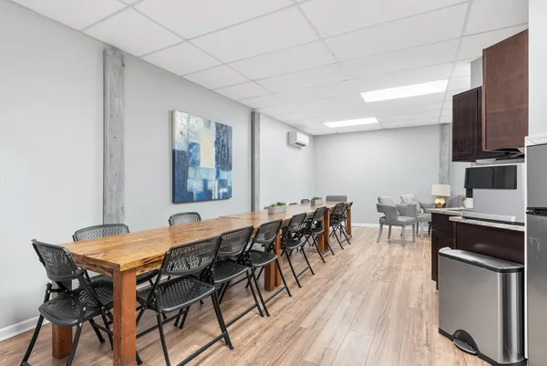 a view of a dining room with furniture and wooden floor