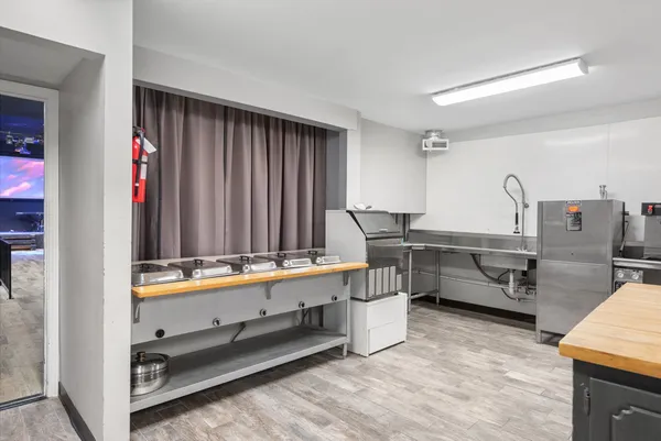 a room with chairs and window