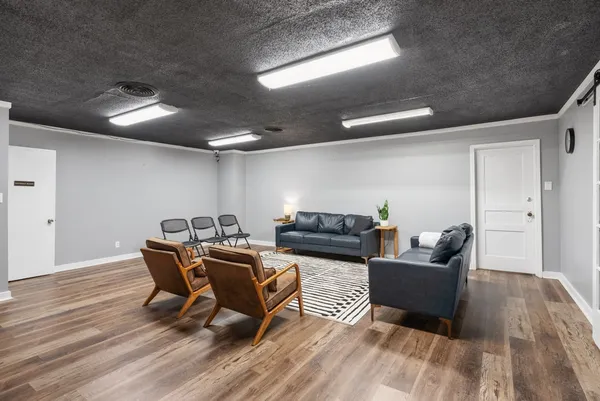 a workspace with furniture and wooden floor